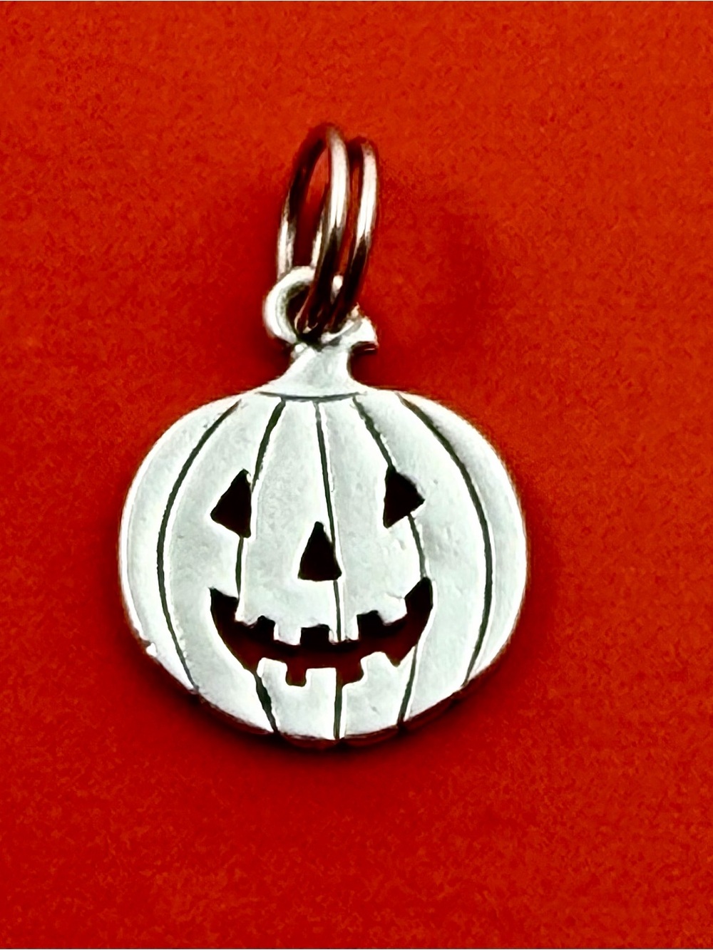 James Avery Silver Pumpkin Jack-O'-Lantern Charm on Orange